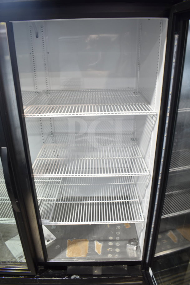 2019 True GDM-49-HC commercial 2-door cooler merchandiser. White interior, four shelves. Tested and working. 115V, 1 phase.
