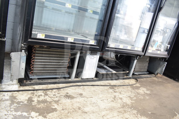 2020 True GDM-72F-HC commercial 3-door freezer; tested, working, 115/208-230V, 1 phase; visible shelves and compressor.
