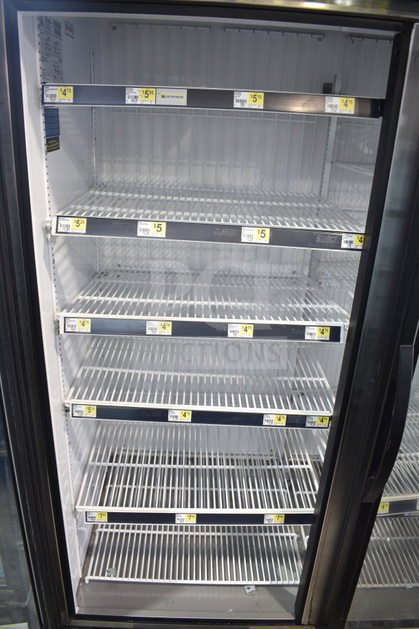 2020 True GDM-72F-HC Commercial 3 Door Freezer, tested and working, shelving labeled with pricing.