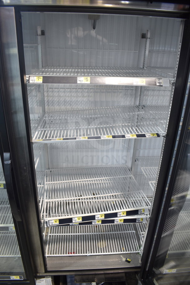 2020 True GDM-72F-HC commercial 3-door reach-in freezer merchandiser; clean shelves; tags show prices; tested and working.