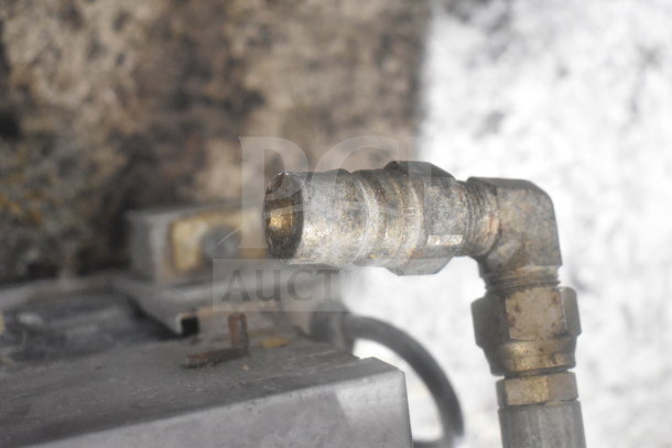ME50 Commercial Portable Oil Filter nozzle detail, model ME50. Metal components show signs of use. 120 Volts, 1 Phase.