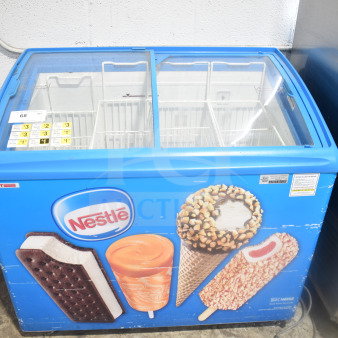 AHT RIO S 100 commercial chest freezer merchandiser, 115 volts, 1 phase, with Nestle branding, features sliding glass lids.