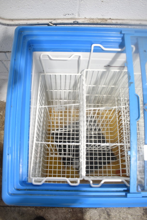 AHT RIO S 100 Commercial Chest Freezer Merchandiser, blue lid, interior baskets, used condition, 115 Volts, 1 Phase.