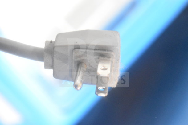 Close-up of power plug for AHT RIO S 100 commercial chest freezer, showing standard three-prong plug, 115 volts, 1 phase.