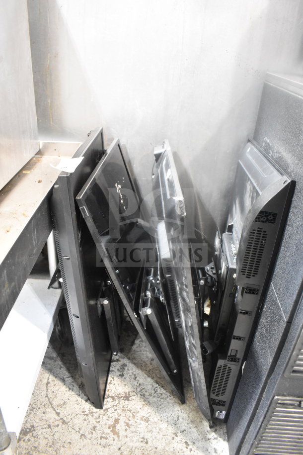 Four televisions including RCA and Philips models, propped upright. Buyer pick-up required, no shipping available.
