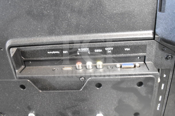 Back panel of a television showing ports for USB, audio, video, and VGA connections.