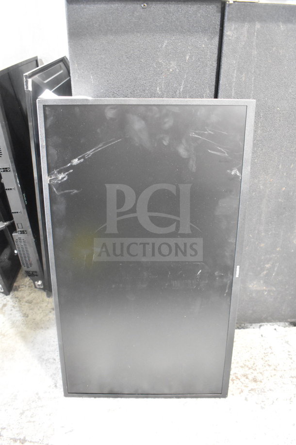 Four televisions, including RCA and Philips models, displayed upright. Visible scratches on screens, sold as-is. Buyer pickup only.