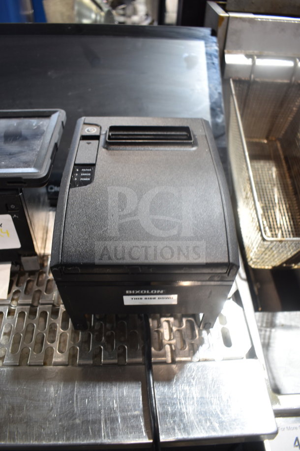 POS system with Bixolon SRP-S300 printer, receipt printer, and monitor. Good condition, visible label on printer.