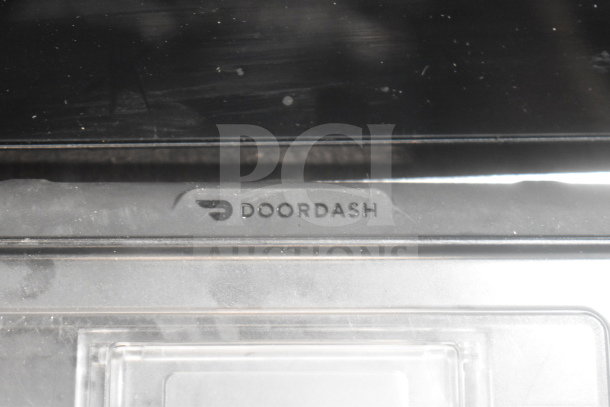 POS monitor with Doordash branding, part of a lot including Bixolon SRP-S300 and Epson receipt printers. Condition: used.