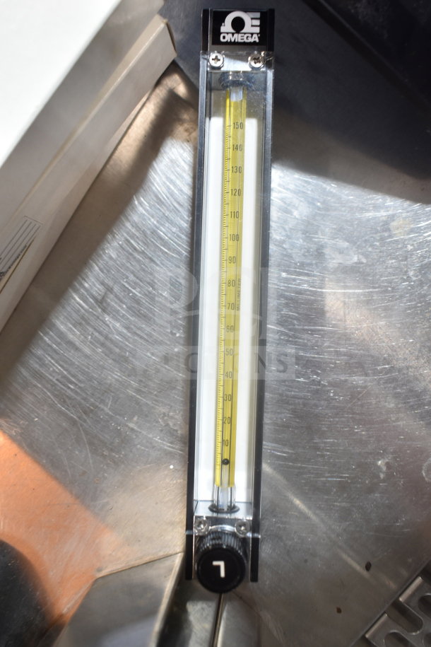 Omega FL-1455-G flowmeter featuring a clear measurement tube and Omega branding on top, in excellent condition.