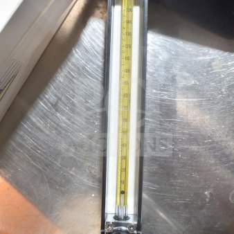 Omega FL-1455-G flowmeter featuring a clear measurement tube and Omega branding on top, in excellent condition.
