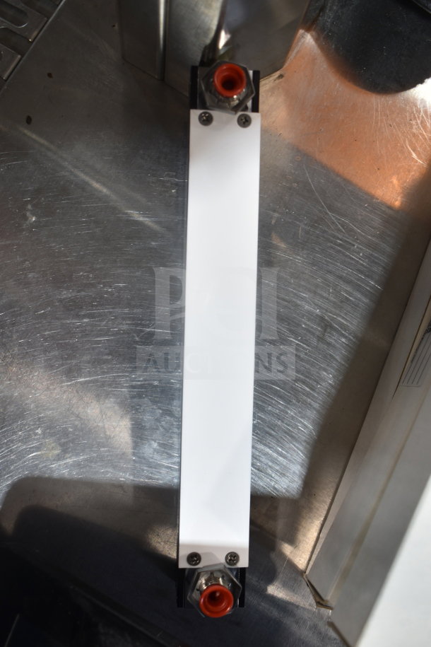 Omega FL-1455-G Flowmeter, vertical orientation, metal body, visible connection fittings. Suitable for accurate flow measurement.