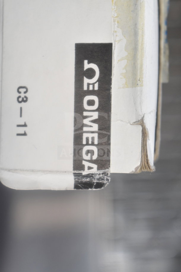 Omega FL-1455-G Flowmeter box with visible Omega logo and label C3-11. Box shows minor wear. Auction includes three units.