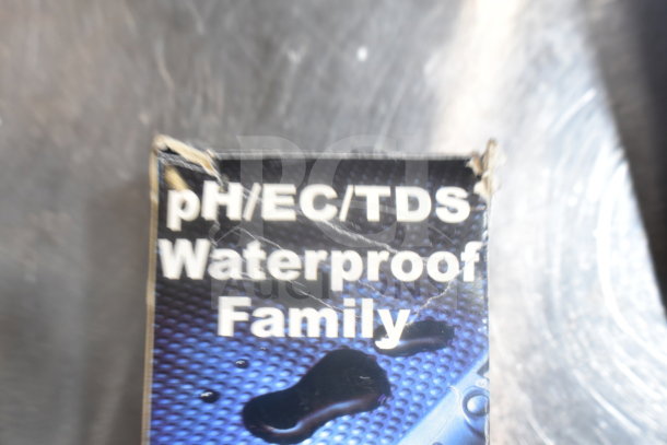 Hanna Instruments pH/EC/TDS Waterproof Meter packaging, visible wear, labeled "Waterproof Family."