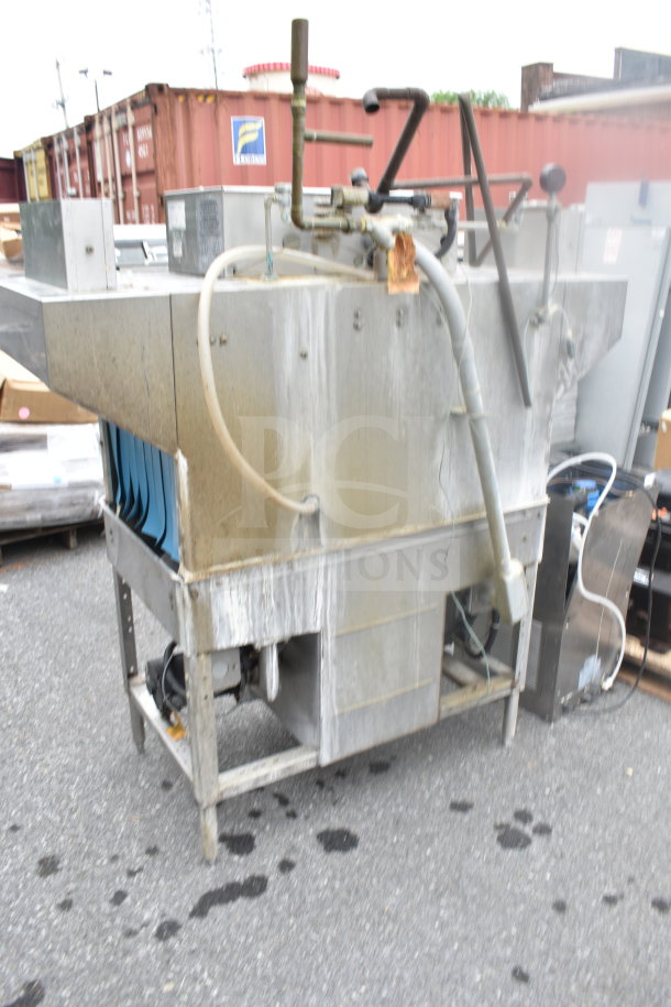 Hobart C44AW commercial conveyor dishwasher, 3 phase, used condition, visible wear, industrial outdoor setting.