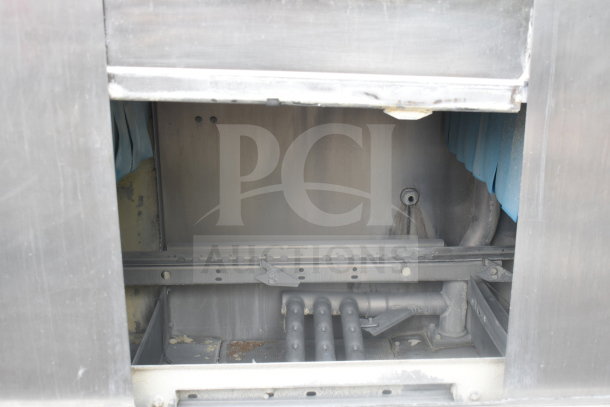 Hobart C44AW commercial conveyor dishwasher, visible internal components, 3-phase, partially open door, industrial condition.