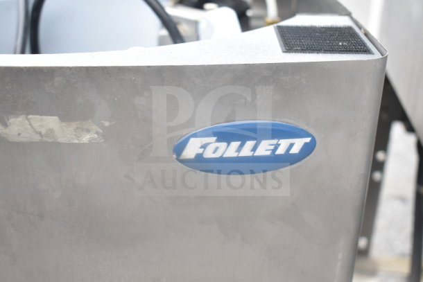 Follett 12CI400A commercial ice and water dispenser, stainless steel finish, 115V, countertop model, visible Follett logo.
