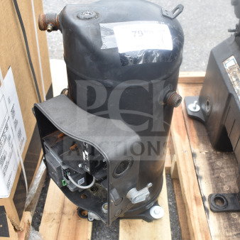 Emerson ZF34K5E-TFD-260 compressor, 3 phase, black, used condition, mounted on a wooden pallet.