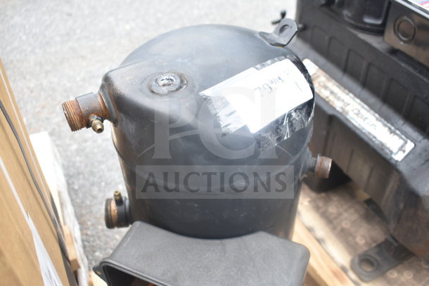 Emerson ZF34K5E-TFD-260 compressor, 3 phase, black with visible rust on connectors, label partially visible.