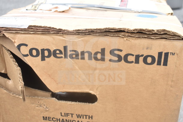 Damaged box labeled "Copeland Scroll" containing Emerson ZF34K5E-TFD-960 Compressor, condition unknown.