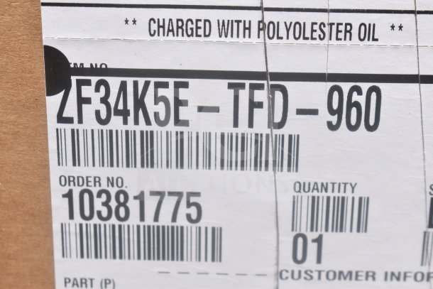 Label on Emerson ZF34K5E-TFD-960 Compressor box showing model and order number. Charged with polyester oil.