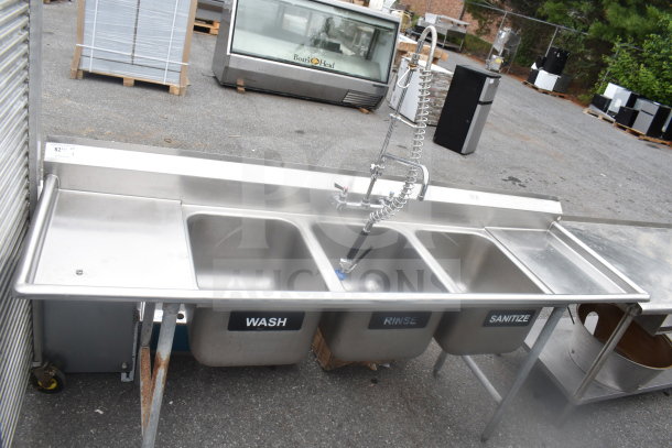 Advance Tabco commercial 3-bay sink with dual drain boards, stainless steel, labeled "Wash," "Rinse," "Sanitize."