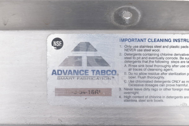 Advance Tabco 3 bay sink label with cleaning instructions and NSF logo, indicating commercial standards.