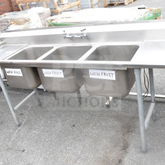 Commercial 3 Bay Sink with dual drain boards, stainless steel, labeled for washing produce, good condition.
