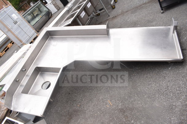Commercial L-shaped stainless steel dish table, right side dirty, without legs, features integrated sink, durable condition.