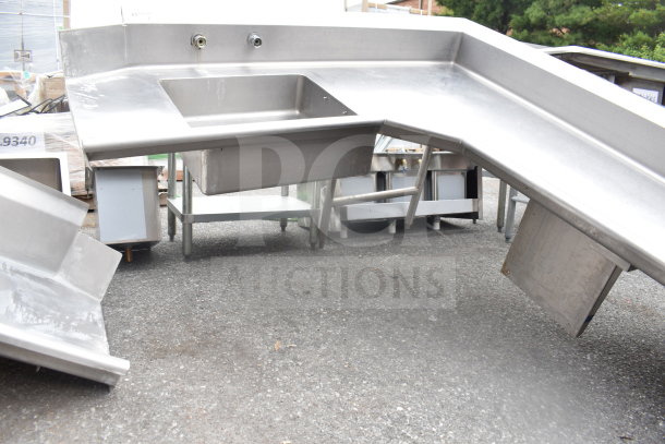 Commercial L-shaped stainless steel dish table, right-side dirty section, no legs, with integrated sink, appears used.
