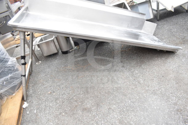 Stainless steel Clean Side Left Side Dishwasher Table in used condition, featuring sturdy legs and a sloped design.