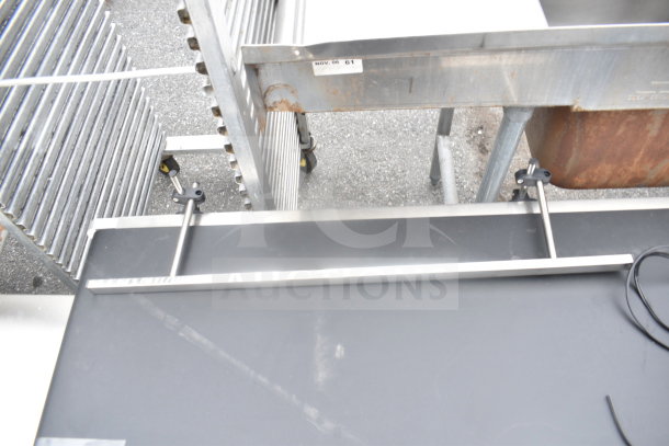 Vevor Belt Conveyor, 110V, 1 Phase, metal frame, black belt, visible wear, ideal for industrial use.