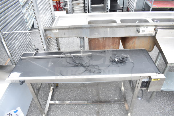 Vevor Belt Conveyor, 110V, 1 Phase. Stainless steel frame, used condition. Vevor label and control panel visible.