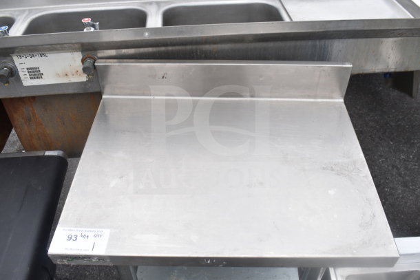 Regency Commercial Table with back splash and under shelf, stainless steel, good condition with minor wear, label visible.
