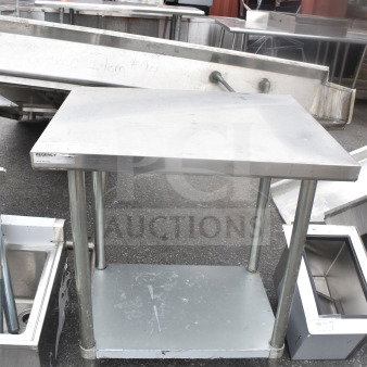 Regency stainless steel table with under shelf, sturdy legs, minor wear, visible brand label, ideal for kitchen use.
