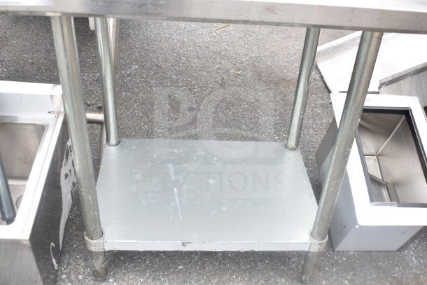 Regency stainless steel table with under shelf. Industrial design, four legs, used condition. Ideal for commercial kitchens.