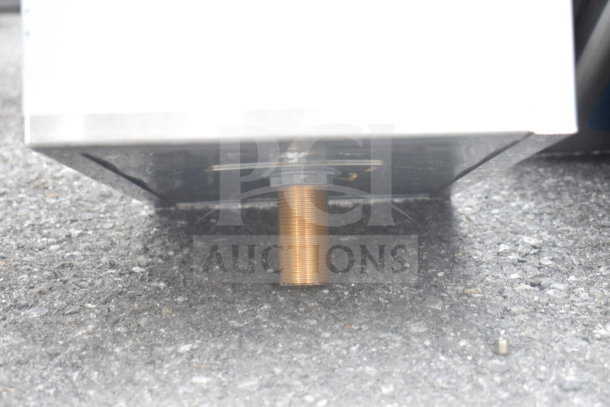 Regency 600DIIB1812 ice bin underside view, showing sturdy construction and threaded outlet, designed for durability.