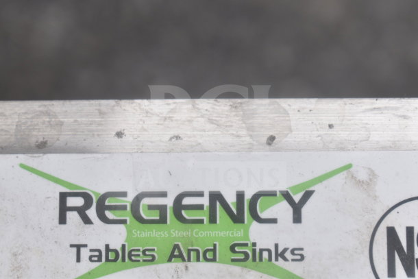 Regency 600DIIB1812 stainless steel drop-in ice bin with sliding lid, 18"x12", 20 lb capacity, commercial use, slight wear.