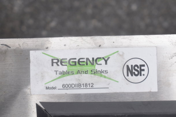 Regency 600DIIB1812 stainless steel drop-in ice bin label, NSF certified, shows model details.