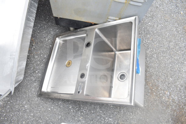 Stainless steel drop-in bay sink, dual basin, visible scratches, used condition, drain fittings included.