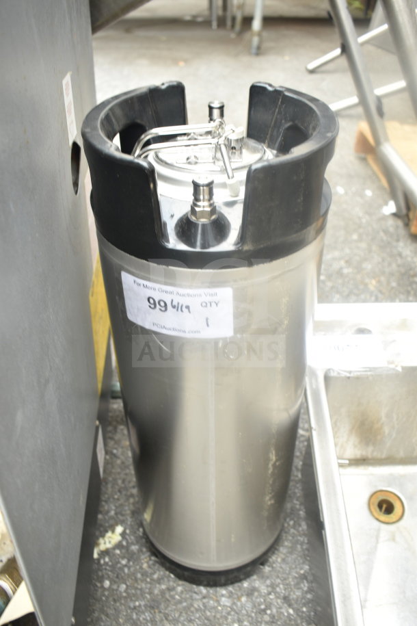 Stainless steel home brew keg with black handles, top valve, and auction label showing number 99619. Good condition.