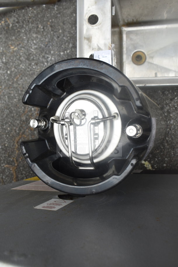 Stainless steel home brew keg with secure lid and dual fittings for inflow and outflow. Ideal for brewing enthusiasts.