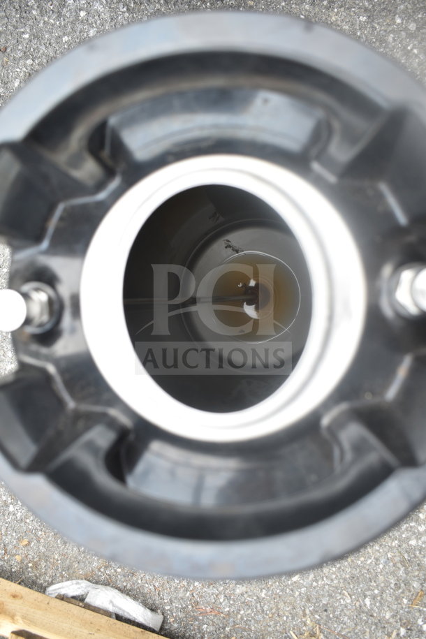 Top view of a home brew keg. Stainless steel interior, secure seals, suitable for home brewing. Good condition.