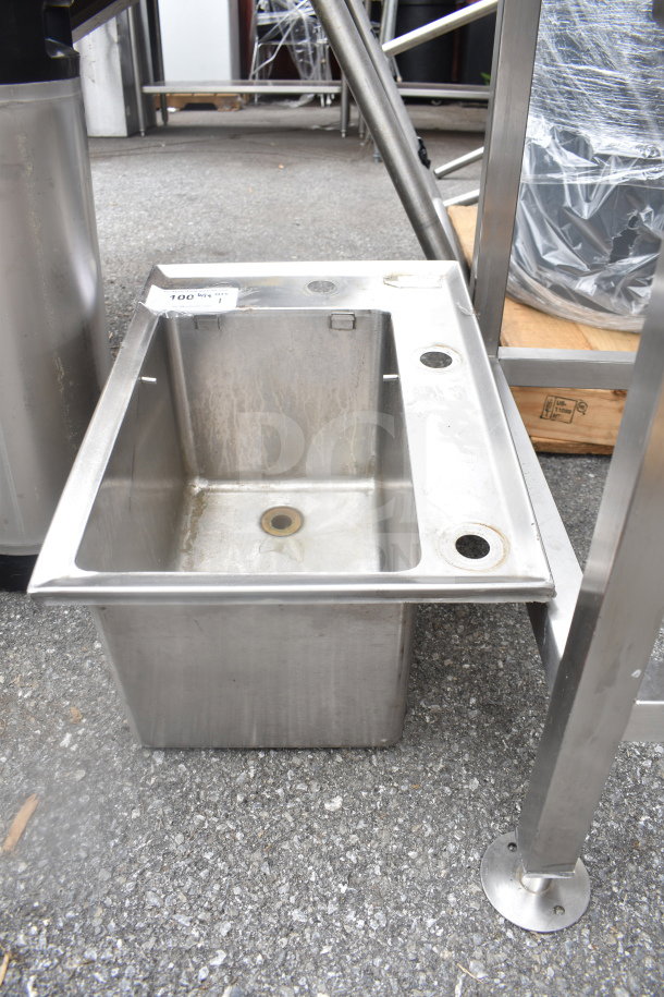 Stainless steel drop-in bay with visible wear. Includes draining outlet. Attached label reads "100.00 qty 1". 