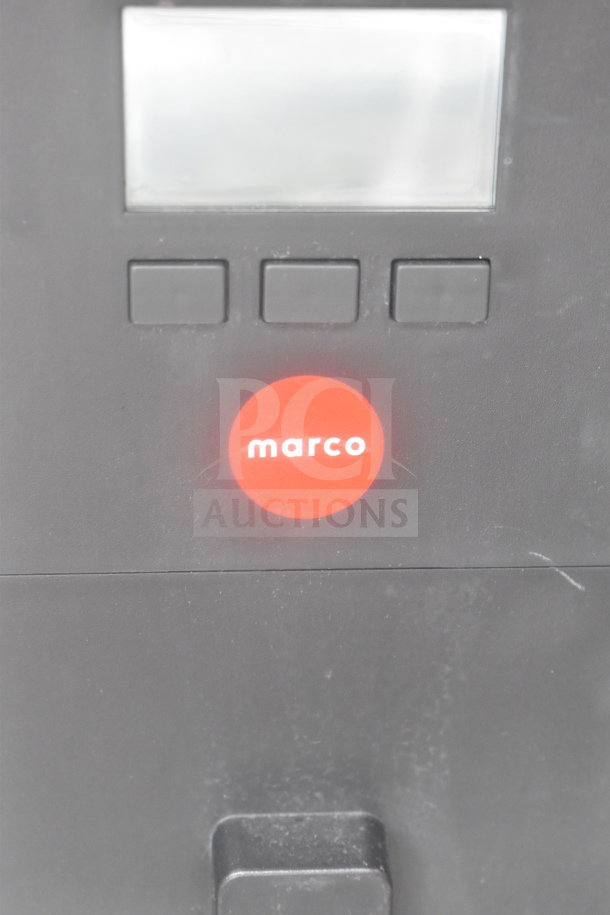 Marco 10018805BX Beverage System panel with red logo, three buttons, and display. Part of a table with sink bay.