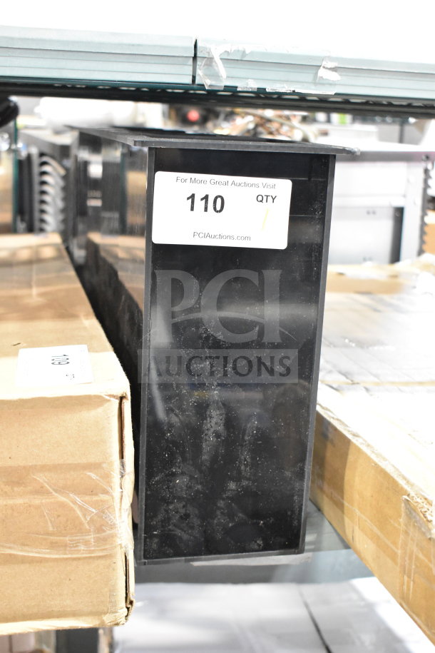 Vollrath black thermoplastic 4-slot lid holder with straw slot. Features flush mount design. Visible tag: "110 QTY".