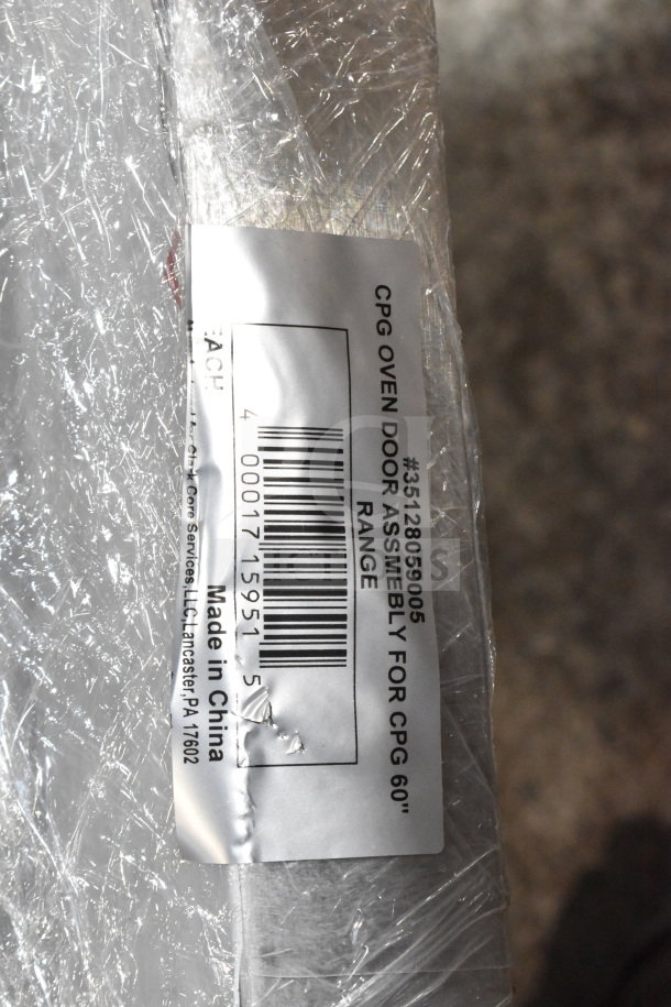 Cooking Performance Group CPG 35128059005 oven door, wrapped in plastic, label shows "Made in China" and barcode.
