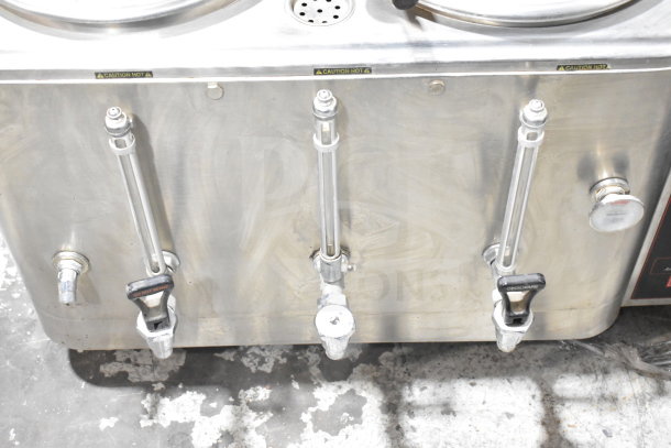 Cecilware CL100-N commercial countertop hot tea urn, stainless steel, visible spouts, "Caution Hot" label, good condition.