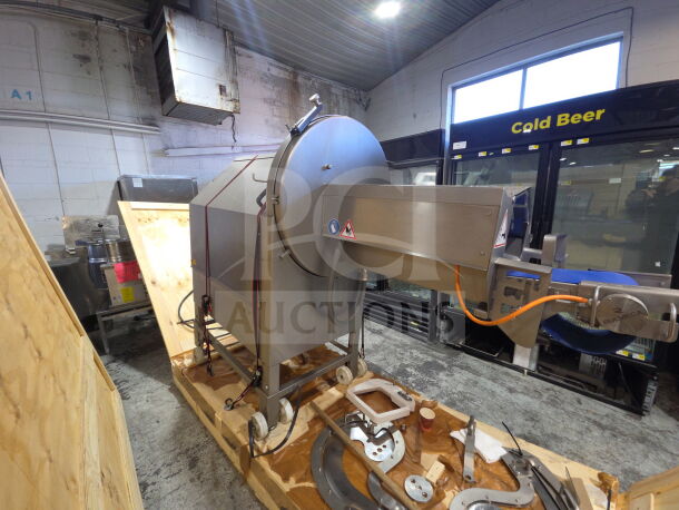 2020 Treif Puma 700 EB meat slicer, horizontal, on commercial casters. Features 220V, 3-phase power. Includes extra parts.