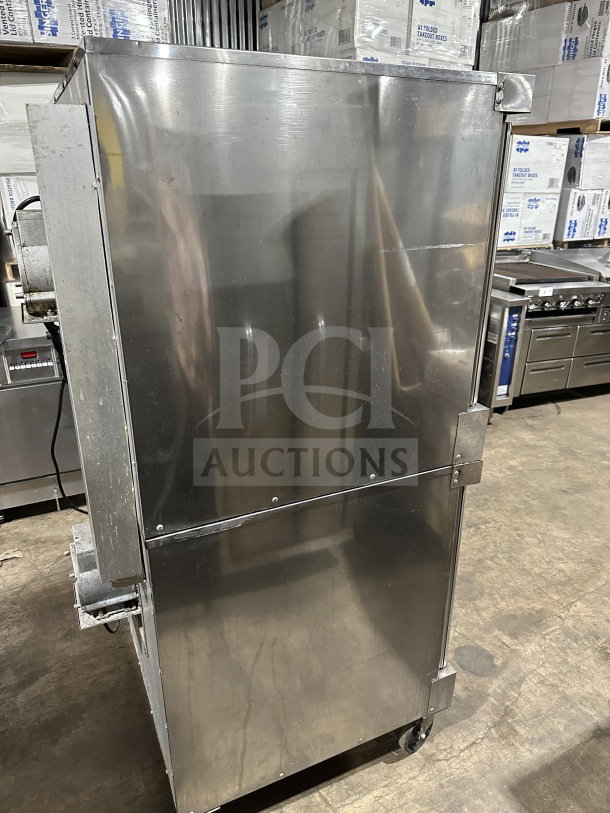 Vulcan VC4GD-11D150K commercial stainless steel double stacked convection oven, gas powered, on casters, with wired rack.